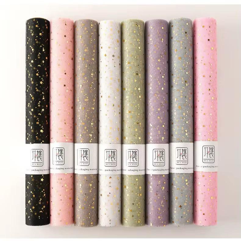 Papier cadeau avec étoiles