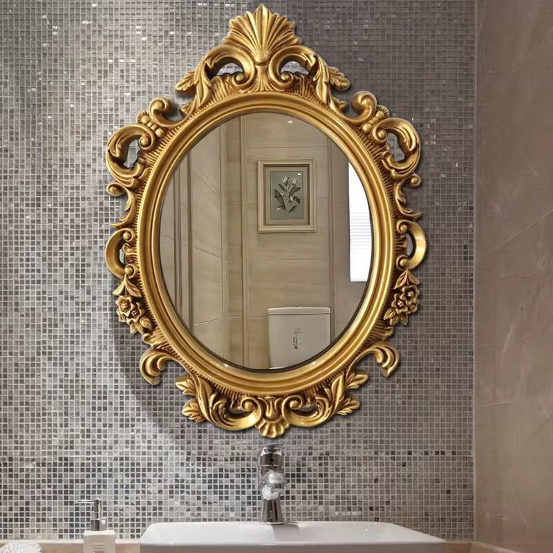 Miroir rond avec cadre doré orné
